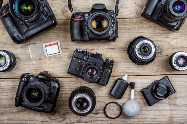 group of old cameras and accessories to be recycled