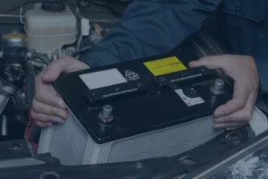 man reading car battery label