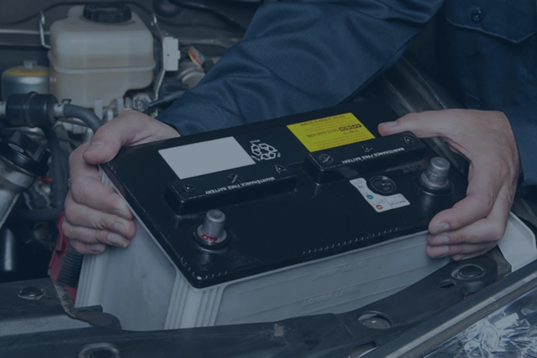 man reading car battery label