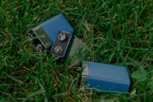 batteries sitting in grass